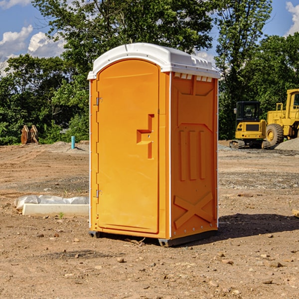 what is the cost difference between standard and deluxe portable toilet rentals in Huggins MO